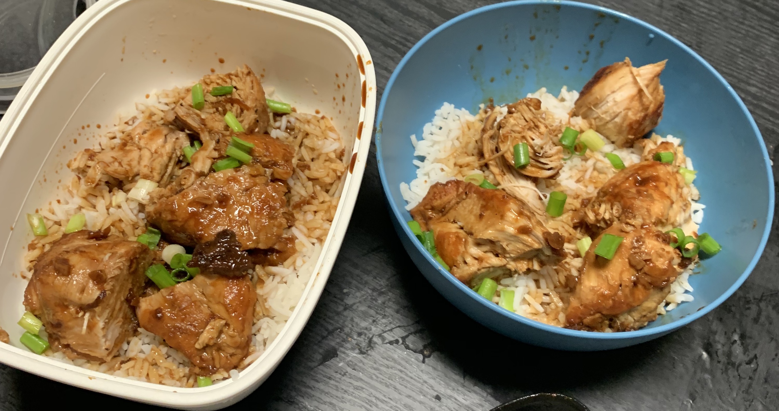 Breasts with sauce over rice garnished with green onions